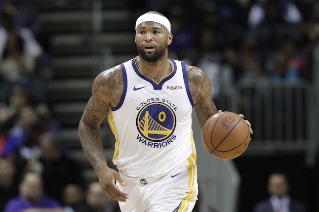 Golden State Warriors' DeMarcus Cousins (0) brings the ball up court during the second half of an NBA basketball game against the Charlotte Hornets in Charlotte, N.C., Monday, Feb. 25, 2019. (AP Photo/Chuck Burton)