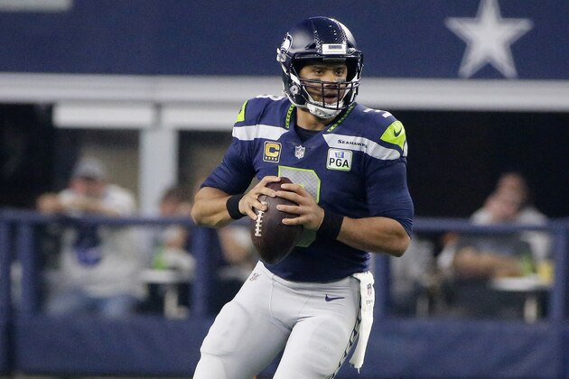 Seattle Seahawks quarterback Russell Wilson (3) works against the Dallas Cowboys first half of the NFC wild-card NFL football game in Arlington, Texas, Saturday, Jan. 5, 2019. (AP Photo/Michael Ainsworth)
