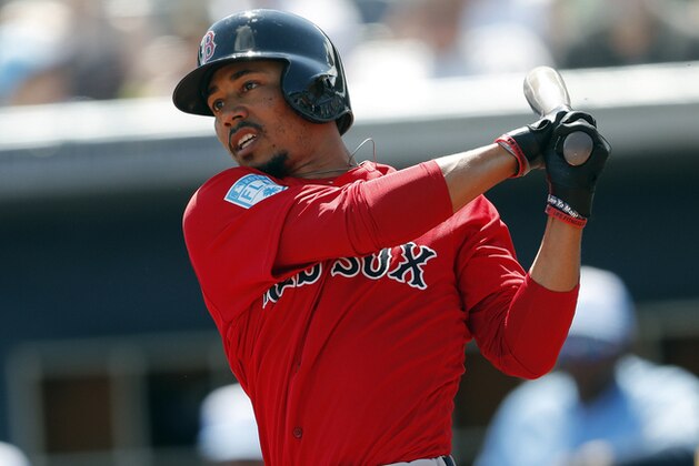 Boston Red Sox' Mookie Betts (50) bats Tampa Bay Rays in a spring training baseball game Sunday, March 10, 2019, in Port Charlotte, Fla. (AP Photo/John Bazemore)