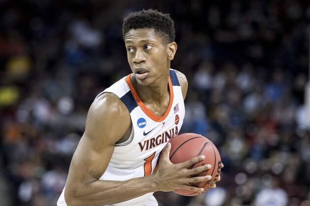 Virginia guard De'Andre Hunter (12) surveys the defense during the first half of a first-round game in the NCAA men's college basketball tournament Friday, March 22, 2019, in Columbia, S.C. (AP Photo/Sean Rayford)
