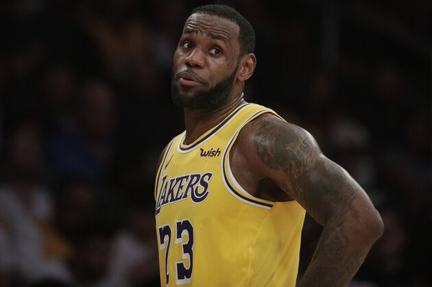 Los Angeles Lakers' LeBron James talks to his teammate during the second half of an NBA basketball game against the Washington Wizards, Tuesday, March 26, 2019, in Los Angeles. The Lakers won 124-106. (AP Photo/Jae C. Hong)
