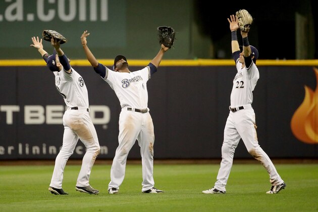 MILWAUKEE, WI - OCTOBER 19:  Ryan Braun #8, Lorenzo Cain #6 and Christian Yelich #22 of the Milwaukee Brewers celebrate after defeating the Los Angeles Dodgers in Game Six of the National League Championship Series at Miller Park on October 19, 2018 in Milwaukee, Wisconsin.  (Photo by Jonathan Daniel/Getty Images)