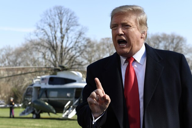 President Donald Trump talks with reporters before boarding Marine One on the South Lawn of the White House in Washington, Thursday, March 28, 2019, for the short trip to Andrews Air Force Base in Maryland. Trump is traveling to Michigan to speak at a rally before spending the weekend at his Mar-a-Lago estate in Florida. (AP Photo/Susan Walsh)