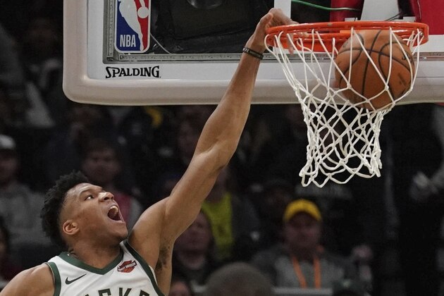 Milwaukee Bucks' Giannis Antetokounmpo dunks during the first half of an NBA basketball game against the Houston Rockets Tuesday, March 26, 2019, in Milwaukee. (AP Photo/Morry Gash)
