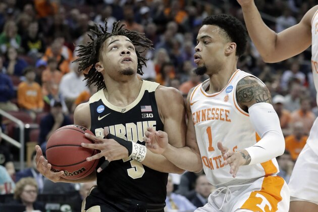 Purdue's Carsen Edwards (3) goes to the basket against Tennessee's Lamonte Turner (1) during the first half of a men's NCAA Tournament college basketball South Regional semifinal game, Thursday, March 28, 2019, in Louisville, Ky. (AP Photo/Michael Conroy)