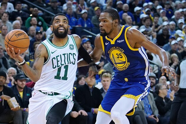 OAKLAND, CA - MARCH 05:  Kyrie Irving #11 of the Boston Celtics drives to the basket on Kevin Durant #35 of the Golden State Warriors during an NBA basketball game at ORACLE Arena on March 5, 2019 in Oakland, California. NOTE TO USER: User expressly acknowledges and agrees that, by downloading and or using this photograph, User is consenting to the terms and conditions of the Getty Images License Agreement.  (Photo by Thearon W. Henderson/Getty Images)