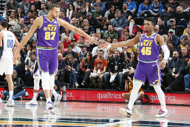 SALT LAKE CITY, UT - JANUARY 9:  Rudy Gobert #27 and Donovan Mitchell #45 of the Utah Jazz exchange high fives against the Orlando Magic on January 9, 2019 at vivint.SmartHome Arena in Salt Lake City, Utah. NOTE TO USER: User expressly acknowledges and agrees that, by downloading and or using this Photograph, User is consenting to the terms and conditions of the Getty Images License Agreement. Mandatory Copyright Notice: Copyright 2019 NBAE (Photo by Melissa Majchrzak/NBAE via Getty Images)