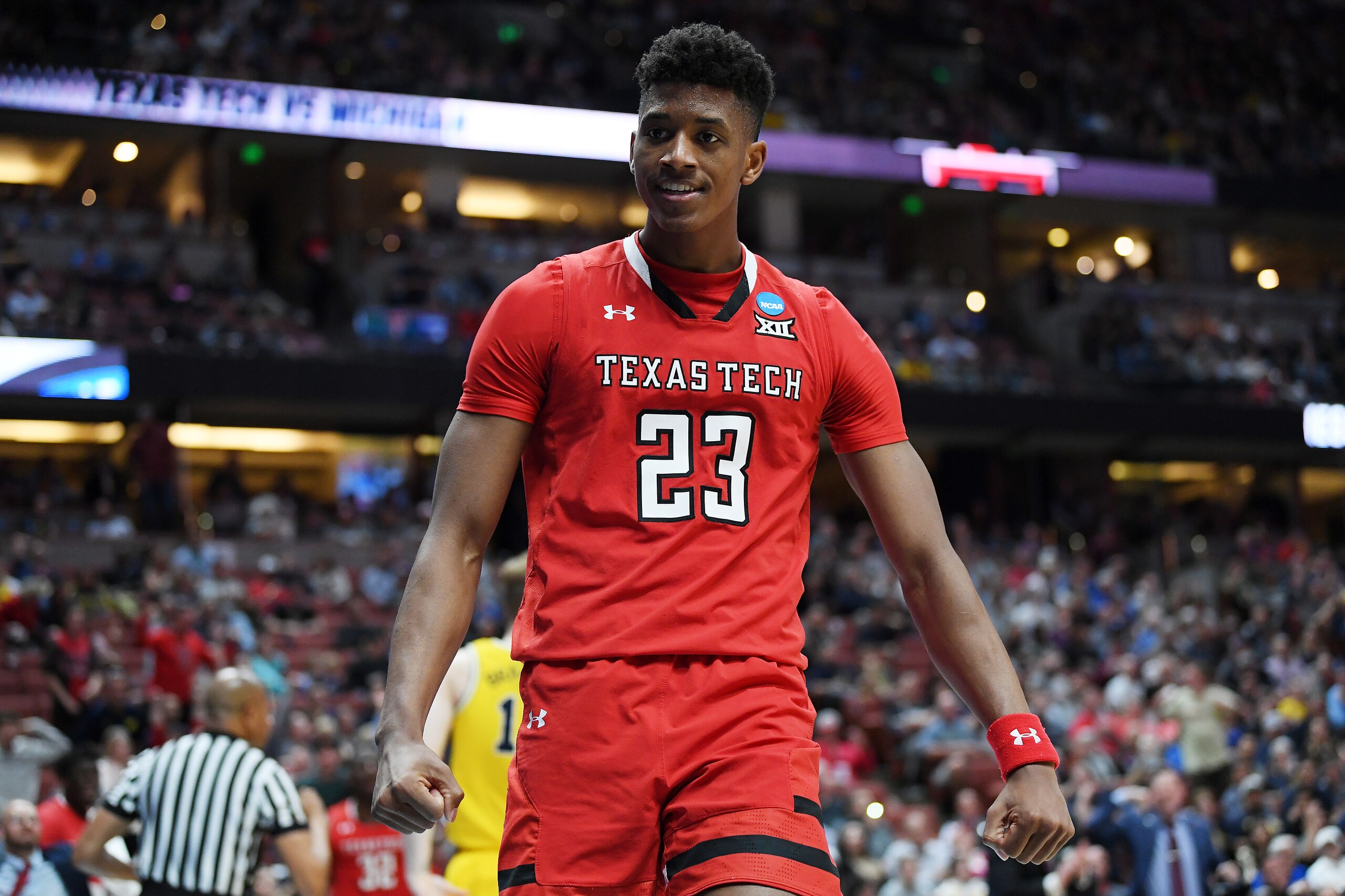 ANAHEIM, CALIFORNIA - MARCH 28: Jarrett Culver #23 of the Texas Tech Red Raiders celebrates after making a basket and drawing a foul against the Michigan Wolverines during the 2019 NCAA Men's Basketball Tournament West Regional at Honda Center on March 28, 2019 in Anaheim, California. (Photo by Harry How/Getty Images)