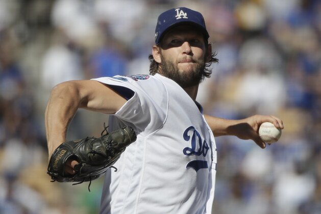 FILE - In this Oct. 17, 2018, file photo, Los Angeles Dodgers starting pitcher Clayton Kershaw throws during the first inning of Game 5 of the baseball NL Championship Series game against the Milwaukee Brewers in Los Angeles. Kershaw and the Dodgers want some more time to consider their possible future together. The three-time NL Cy Young Award winner and the team have agreed to extend the deadline on his option decision by 40 hours until 1 p.m. PDT Friday. (AP Photo/Jae Hong, File)