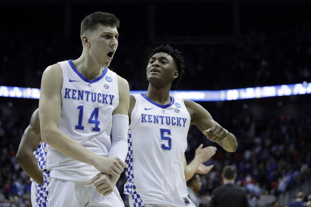 Kentucky's Tyler Herro (14) and Immanuel Quickley celebrate following a men's NCAA tournament college basketball Midwest Regional semifinal game against Houston Friday, March 29, 2019, in Kansas City, Mo. (AP Photo/Charlie Riedel)
