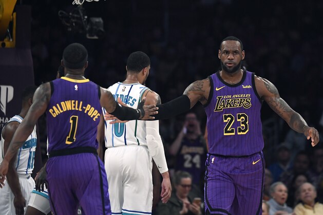 LOS ANGELES, CA - MARCH 29: LeBron James #23 of the Los Angeles Lakers is congratulated by Kentavious Caldwell-Pope #1 after scoring a basket and getting fouled during the game against Charlotte Hornets at Staples Center on March 29, 2019 in Los Angeles, California. NOTE TO USER: User expressly acknowledges and agrees that, by downloading and or using this photograph, User is consenting to the terms and conditions of the Getty Images License Agreement. (Photo by Kevork Djansezian/Getty Images)