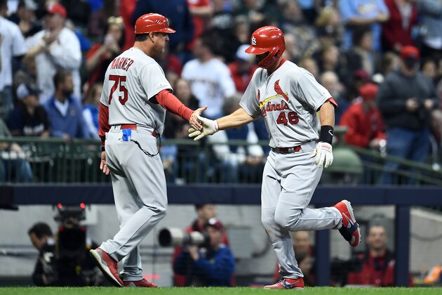 MILWAUKEE, WISCONSIN - MARCH 29:  Paul Goldschmidt #46 of the St. Louis Cardinals is congratulated by third base coach Ron 'Pop' Warner #75 following a home run during the sixth inning of a game against the Milwaukee Brewers at Miller Park on March 29, 2019 in Milwaukee, Wisconsin. (Photo by Stacy Revere/Getty Images)