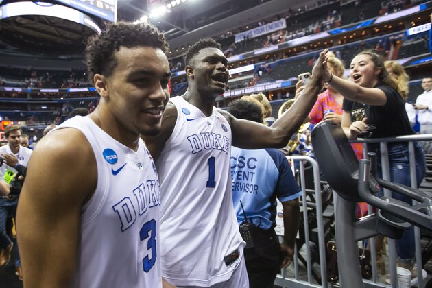 Duke guard Tre Jones (3) and forward Zion Williamson (1) celebrate as they leave the court after the team's NCAA men's college basketball tournament East Region semifinal against Virginia Tech in Washington, Friday, March 29, 2019. Duke won 75-73. (AP Photo/Alex Brandon)