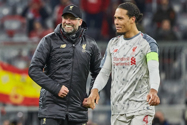 MUNICH, GERMANY - MARCH 13: Head coach Juergen Klopp of Liverpool and Virgil Van Dijk of Liverpool celebrate after winning the UEFA Champions League Round of 16 Second Leg match between FC Bayern Muenchen and Liverpool at Allianz Arena on March 13, 2019 in Munich, Germany. (Photo by TF-Images/Getty Images)
