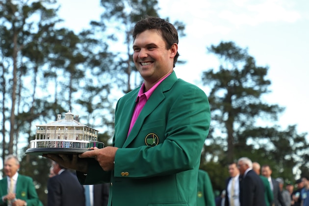 AUGUSTA, GA - APRIL 08: Patrick Reed of the United States celebrates with the trophy during the green jacket ceremony after winning the 2018 Masters Tournament at Augusta National Golf Club on April 8, 2018 in Augusta, Georgia. (Photo by Patrick Smith/Getty Images)