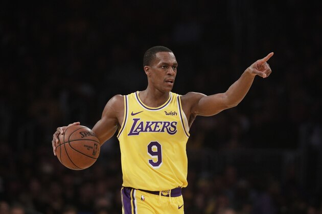 Los Angeles Lakers' Rajon Rondo dribbles the ball during the first half of an NBA basketball game against the Boston Celtics, Saturday, March 9, 2019, in Los Angeles. (AP Photo/Jae C. Hong)