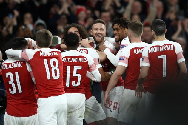 LONDON, ENGLAND - MARCH 14: Pierre-Emerick Aubameyang of Arsenal (obscurred) celebrates with Shkodran Mustafi and teammates after scoring his team's third goal during the UEFA Europa League Round of 16 Second Leg match between Arsenal and Stade Rennais at Emirates Stadium on March 14, 2019 in London, England. (Photo by Bryn Lennon/Getty Images)