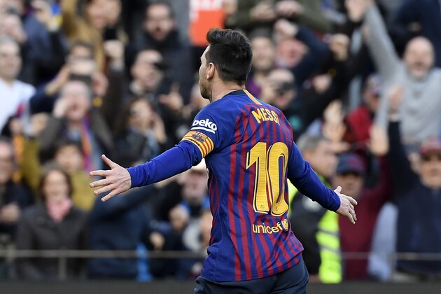 Barcelona's Argentinian forward Lionel Messi celebrates after scoring a goal during the Spanish league football match between FC Barcelona and RCD Espanyol at the Camp Nou stadium in Barcelona on March 30, 2019. (Photo by LLUIS GENE / AFP)        (Photo credit should read LLUIS GENE/AFP/Getty Images)