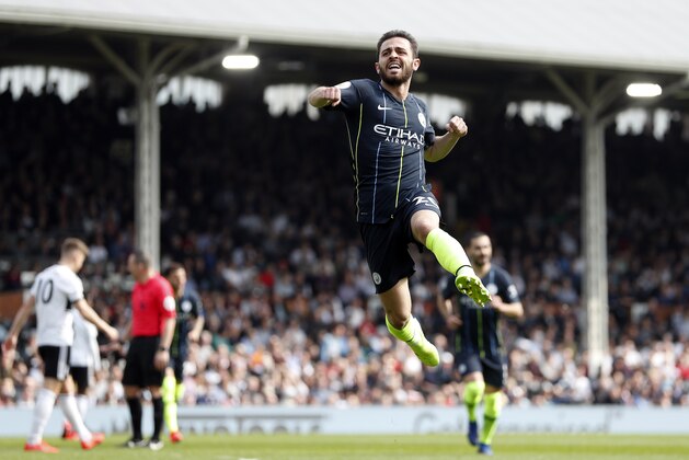 Manchester City's Bernardo Silva celebrates after scoring the opening goal during the English Premier League soccer match between Fulham and Manchester City at Craven Cottage stadium in London, Saturday, March 30, 2019. (AP Photo/Alastair Grant)