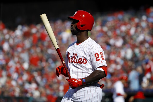 Philadelphia Phillies' Andrew McCutchen in action during an opening day baseball game against the Atlanta Braves, Thursday, March 28, 2019, in Philadelphia. (AP Photo/Matt Slocum)