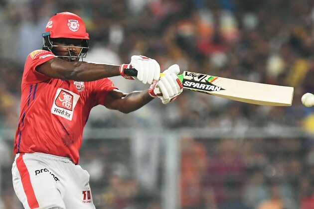 Kings XI Punjab's cricketer Chris Gayle plays a shot during the Indian Premier League (IPL) Twenty20 cricket match between Kolkata Knight Riders and Kings XI Punjab at the Eden Gardens Stadium in Kolkata on March 27, 2019. (Photo by Dibyangshu SARKAR / AFP)        (Photo credit should read DIBYANGSHU SARKAR/AFP/Getty Images)