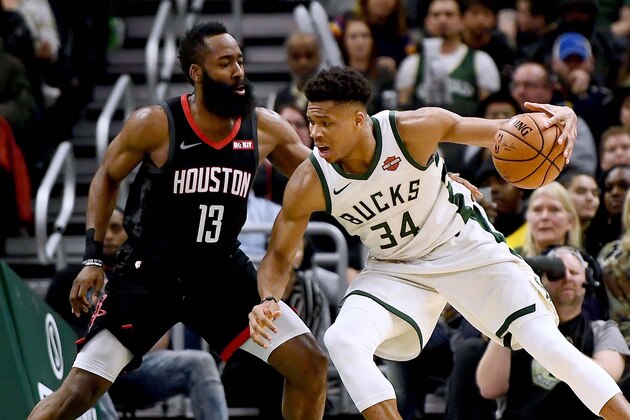 MILWAUKEE, WISCONSIN - MARCH 26:  Giannis Antetokounmpo #34 of the Milwaukee Bucks is defended by James Harden #13 of the Houston Rockets during the second half of a game at Fiserv Forum on March 26, 2019 in Milwaukee, Wisconsin. NOTE TO USER: User expressly acknowledges and agrees that, by downloading and or using this photograph, User is consenting to the terms and conditions of the Getty Images License Agreement. (Photo by Stacy Revere/Getty Images)