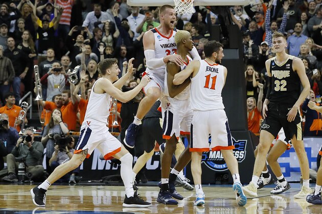 LOUISVILLE, KENTUCKY - MARCH 30:  Mamadi Diakite #25 of the Virginia Cavaliers celebrates with teammates after making a game-tying shot over Matt Haarms #32 of the Purdue Boilermakers to extend the game to overtime as time expires in the second half of the 2019 NCAA Men's Basketball Tournament South Regional at KFC YUM! Center on March 30, 2019 in Louisville, Kentucky. (Photo by Kevin C.  Cox/Getty Images)