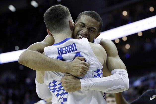 CORRECTS TO KELDON JOHNSON, INSTEAD OF PJ WASHINGTON - Kentucky's Keldon Johnson, rear, celebrates with teammate Tyler Herro near the end of a men's NCAA tournament college basketball Midwest Regional semifinal against Houston, Friday, March 29, 2019, in Kansas City, Mo. (AP Photo/Charlie Riedel)