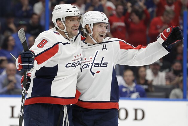 Washington Capitals' Alex Ovechkin (8) celebrates with center Nicklas Backstrom (19) after scoring against the Tampa Bay Lightning during the third period of an NHL hockey game Saturday, March 30, 2019, in Tampa, Fla. (AP Photo/Chris O'Meara)