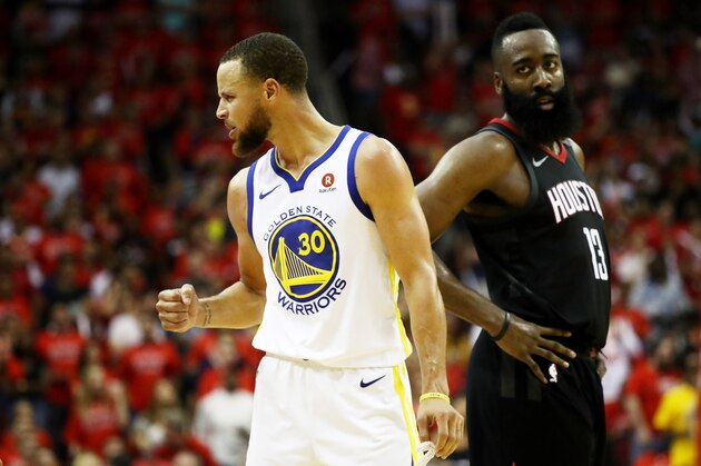 HOUSTON, TX - MAY 28:  Stephen Curry #30 of the Golden State Warriors reacts as James Harden #13 of the Houston Rockets looks on in the third quarter of Game Seven of the Western Conference Finals of the 2018 NBA Playoffs at Toyota Center on May 28, 2018 in Houston, Texas. NOTE TO USER: User expressly acknowledges and agrees that, by downloading and or using this photograph, User is consenting to the terms and conditions of the Getty Images License Agreement.  (Photo by Ronald Martinez/Getty Images)