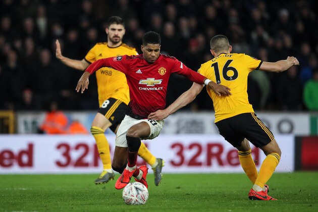 WOLVERHAMPTON, ENGLAND - MARCH 16:  Marcus Rashford of Manchester United and Conor Coady of Wolverhampton Wanderers during the FA Cup Quarter Final match between Wolverhampton Wanderers and Manchester United at Molineux on March 16, 2019 in Wolverhampton, England. (Photo by Matthew Ashton - AMA/Getty Images)