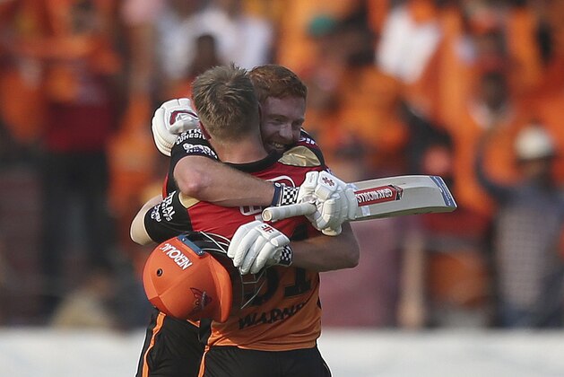 Sunrisers Hyderabad's David Warner hugs Jonny Bairstow on scoring hundred runs against Royal Challengers Bangalore during the VIVO IPL T20 cricket match in Hyderabad, India, Sunday, March 31, 2019. (AP Photo/ Mahesh Kumar A.)
