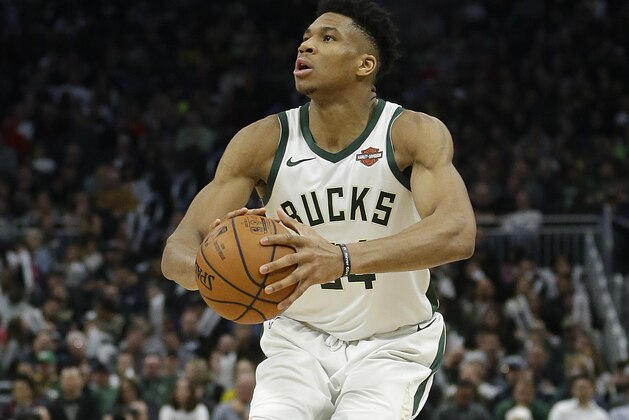 Milwaukee Bucks' Giannis Antetokounmpo shoots during the second half of an NBA basketball game against the LA Clippers Thursday, March 28, 2019, in Milwaukee. The Bucks won 128-118. (AP Photo/Aaron Gash)