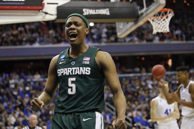 Michigan State guard Cassius Winston (5) reacts to scoring on Duke during the first half of an NCAA men's East Regional final college basketball game in Washington, Sunday, March 31, 2019. (AP Photo/Alex Brandon)