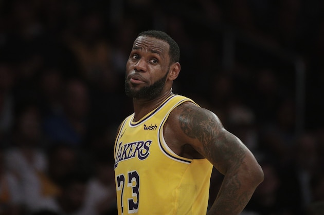 Los Angeles Lakers' LeBron James talks to his teammate during the second half of an NBA basketball game against the Washington Wizards, Tuesday, March 26, 2019, in Los Angeles. The Lakers won 124-106. (AP Photo/Jae C. Hong)