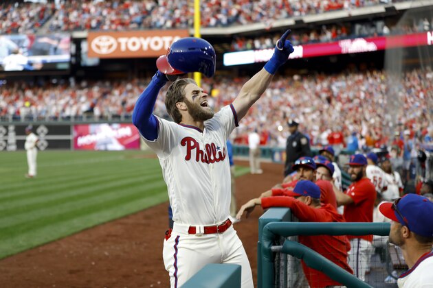 Philadelphia Phillies' Bryce Harper celebrates after hitting a home run off Atlanta Braves' Jesse Biddle during the seventh inning of a baseball game, Saturday, March 30, 2019, in Philadelphia. (AP Photo/Matt Slocum)