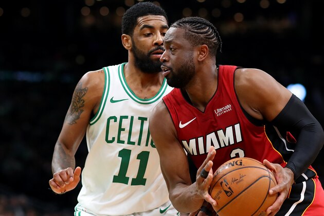BOSTON, MASSACHUSETTS - APRIL 01: Dwyane Wade #3 of the Miami Heat drives against Kyrie Irving #11 of the Boston Celtics during the second quarter at TD Garden on April 01, 2019 in Boston, Massachusetts. NOTE TO USER: User expressly acknowledges and agrees that, by downloading and or using this photograph, User is consenting to the terms and conditions of the Getty Images License Agreement. (Photo by Maddie Meyer/Getty Images)