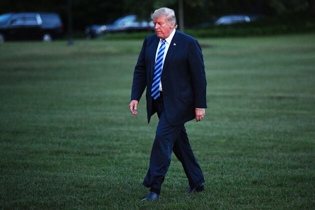US President Donald Trump makes his way across the South Lawn upon return to the White House in Washington, DC, on August 13, 2018. - Trump returned to Washington after vacationing at his Bedminster, New Jersey golf resort. (Photo by MANDEL NGAN / AFP)        (Photo credit should read MANDEL NGAN/AFP/Getty Images)