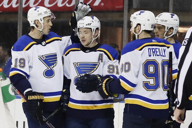 St. Louis Blues' Vladimir Tarasenko (91) celebrates with teammates Jay Bouwmeester (19) and Ryan O'Reilly (90) after scoring a goal during the first period of an NHL hockey game against the New York Rangers Friday, March 29, 2019, in New York. (AP Photo/Frank Franklin II)