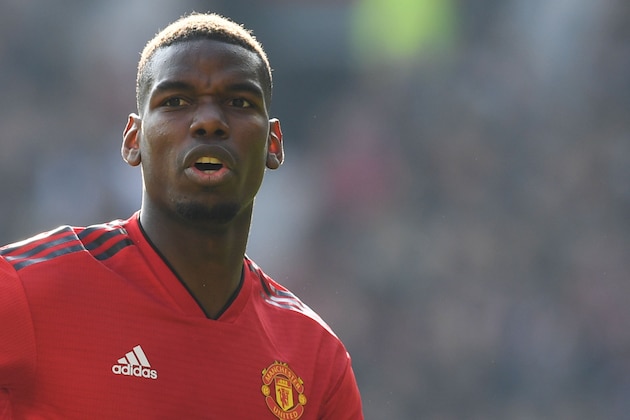 Manchester United's French midfielder Paul Pogba reacts during the English Premier League football match between Manchester United and Watford at Old Trafford in Manchester, north west England, on March 30, 2019. (Photo by Paul ELLIS / AFP) / RESTRICTED TO EDITORIAL USE. No use with unauthorized audio, video, data, fixture lists, club/league logos or 'live' services. Online in-match use limited to 120 images. An additional 40 images may be used in extra time. No video emulation. Social media in-match use limited to 120 images. An additional 40 images may be used in extra time. No use in betting publications, games or single club/league/player publications. /         (Photo credit should read PAUL ELLIS/AFP/Getty Images)