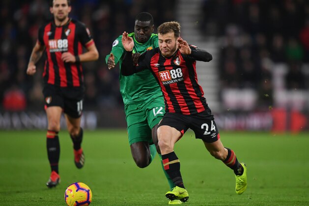 BOURNEMOUTH, ENGLAND - JANUARY 02:  Ryan Fraser of AFC Bournemouth holds off Ken Sema of Watford during the Premier League match between AFC Bournemouth and Watford FC at Vitality Stadium on January 2, 2019 in Bournemouth, United Kingdom.  (Photo by Dan Mullan/Getty Images)