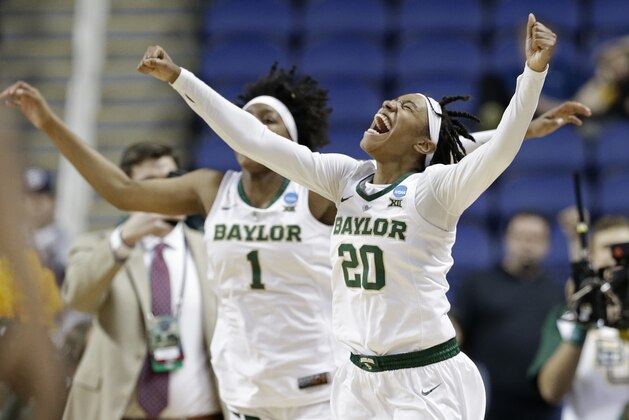 Baylor's Juicy Landrum (20) and NaLyssa Smith (1) celebrate their win over Iowa in a regional final women's college basketball game in the NCAA Tournament in Greensboro, N.C., Monday, April 1, 2019. (AP Photo/Gerry Broome)