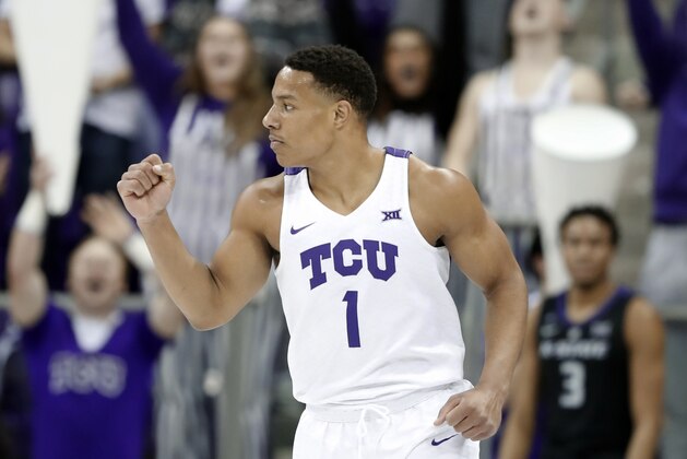TCU guard Desmond Bane (1) celebrates sinking a three-point basket in the first half of an NCAA college basketball game against Kansas State in Fort Worth, Texas, Monday, March 4, 2019. (AP Photo/Tony Gutierrez)