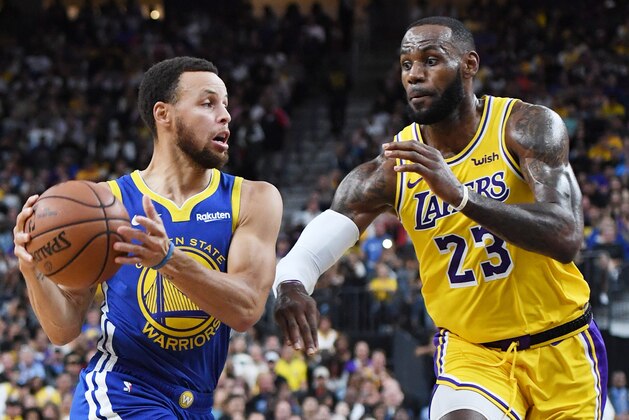 LAS VEGAS, NEVADA - OCTOBER 10:  Stephen Curry #30 of the Golden State Warriors drives against LeBron James #23 of the Los Angeles Lakers during their preseason game at T-Mobile Arena on October 10, 2018 in Las Vegas, Nevada. The Lakers defeated the Warriors 123-113. NOTE TO USER: User expressly acknowledges and agrees that, by downloading and or using this photograph, User is consenting to the terms and conditions of the Getty Images License Agreement.  (Photo by Ethan Miller/Getty Images)