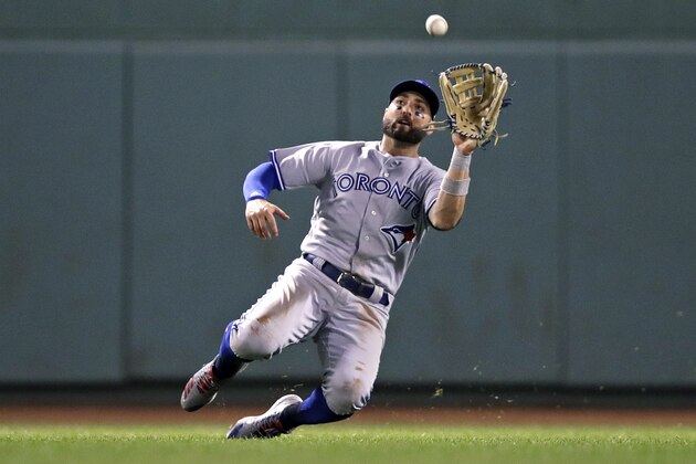 Toronto Blue Jays center fielder Kevin Pillar makes the catch on a fly out by Boston Red Sox's Mookie Betts during the sixth inning of a baseball game at Fenway Park in Boston, Tuesday, Sept. 11, 2018. (AP Photo/Charles Krupa)