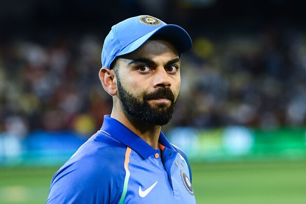 India's captain Virat Kohli arrives on the field for the presentation after defeating Australia during the third one-day international cricket match at the Melbourne Cricket Ground in Melbourne on January 18, 2019. (Photo by Jewel SAMAD / AFP) / -- IMAGE RESTRICTED TO EDITORIAL USE - STRICTLY NO COMMERCIAL USE --        (Photo credit should read JEWEL SAMAD/AFP/Getty Images)