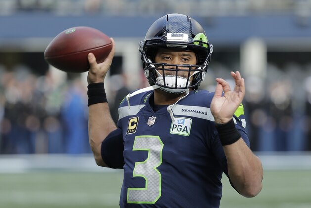Seattle Seahawks quarterback Russell Wilson warms up before an NFL football game against the Arizona Cardinals, Sunday, Dec. 30, 2018, in Seattle. (AP Photo/Ted S. Warren)
