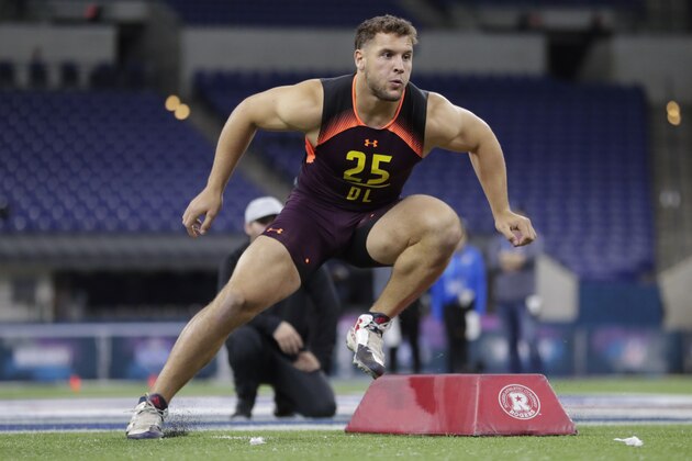 Ohio State defensive lineman Nick Bosa runs a drill at the NFL football scouting combine in Indianapolis, Sunday, March 3, 2019. (AP Photo/Michael Conroy)
