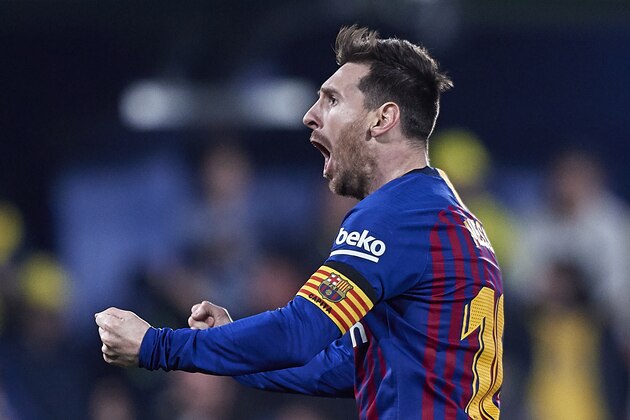 VILLAREAL, SPAIN - APRIL 02:  Lionel Messi of FC Barcelona celebrates his team's fourth goal scored by Luis Suarez of FC Barcelona during the La Liga match between Villarreal CF and FC Barcelona at Estadio de la Ceramica on April 02, 2019 in Villareal, Spain. (Photo by Quality Sport Images/Getty Images)