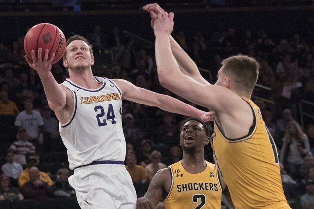 Lipscomb guard Garrison Mathews (24) goes to the basket against Wichita State guard Jamarius Burton (2) and guard Erik Stevenson (10) during the first half of a semifinal college basketball game in the National Invitational Tournament, Tuesday, April 2, 2019, at Madison Square Garden in New York. (AP Photo/Mary Altaffer)